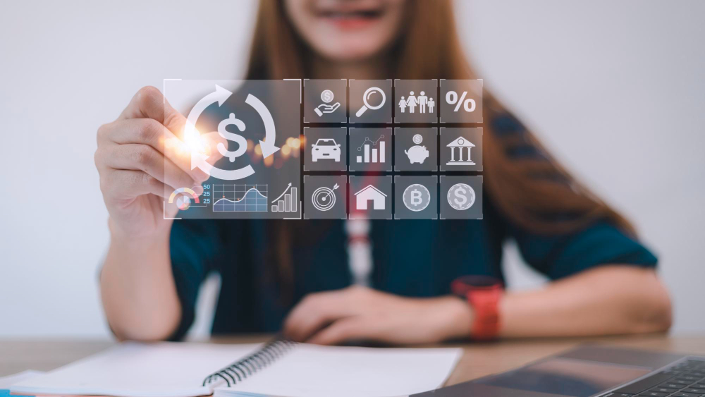 Businesswoman using digital financial management tools, representing innovative payroll solutions.